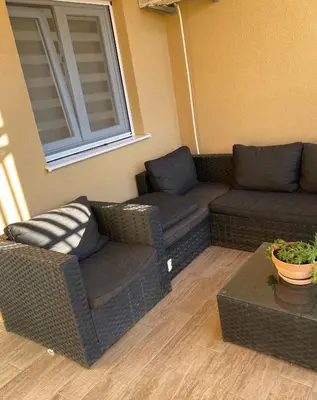 a living room with a couch and a table at Apartments Boss in Budva