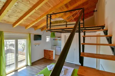 a bedroom with a bunk bed in a tiny house at Lakeview Apartments Anđela in Virpazar