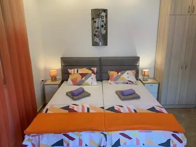 a bedroom with a bed with two pillows on it at Villa Lili in Kotor