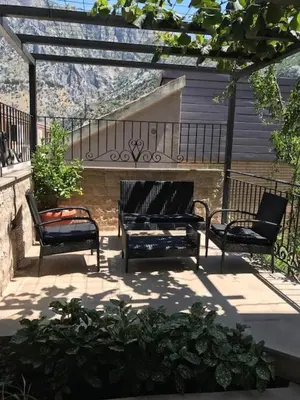 three benches sitting on a patio with a view at Villa Lili in Kotor