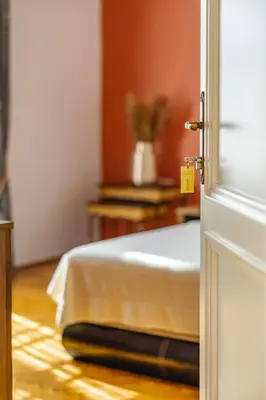 an open door to a bedroom with a bed at Le Petit Chateau in Bar