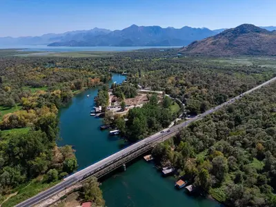 an aerial view of a bridge over a river at Apartments Obala in Podgorica