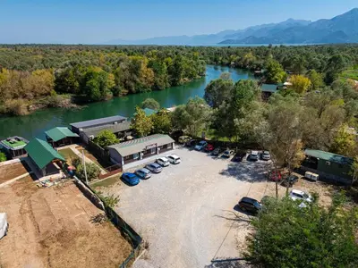 an aerial view of a parking lot next to a river at Apartments Obala in Podgorica