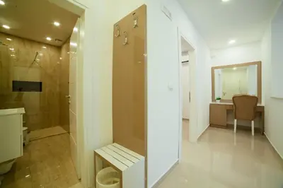 a bathroom with a shower and a toilet and a sink at Hotel Ambiente Ulcinj in Ulcinj