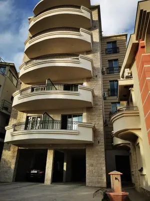 an apartment building with balconies on the side of it at Apolon Apart in Bar, Susanj