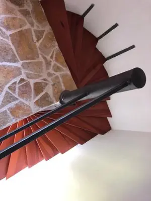 a pair of umbrellas sitting on top of a wall at Skadar lake house Bobija in Podgorica