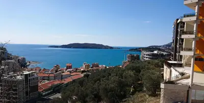 a view of a city and the ocean with buildings at Rafailovici Studio Vita in Rafailovici