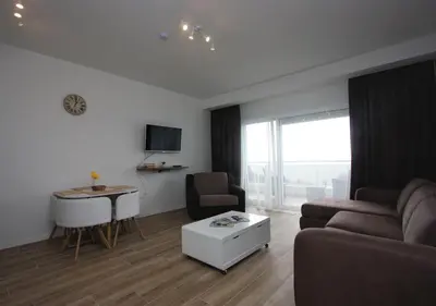 a living room with a couch and a table at Rafailovici Studio Vita in Rafailovici