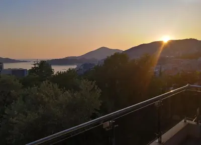 a view of the sunset from a balcony at Rafailovici Studio Vita in Rafailovici