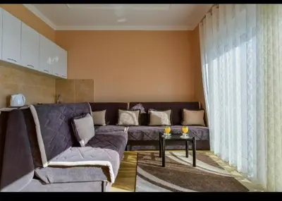a living room with a couch and a table at Apartments Hillside in Ulcinj
