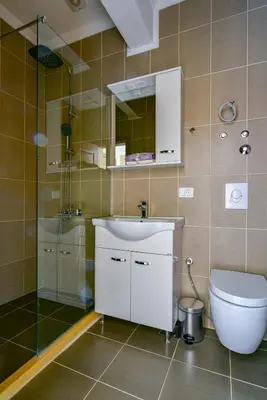 a bathroom with a toilet and a sink and a shower at Apartments Hillside in Ulcinj