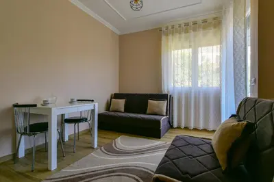 a living room with a couch and a table at Apartments Hillside in Ulcinj