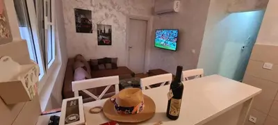 a bottle of wine on a table in a living room at Apartment Boki in Budva