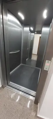 a refrigerator with a glass door in a room at Apartment Boki in Budva