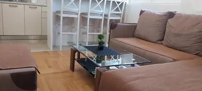 a living room with a couch and a table at Apartment Boki in Budva