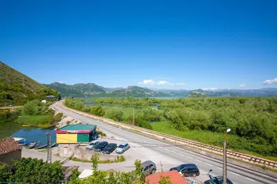 a highway with cars parked in a parking lot at Skadar Lake Apartment-Nikola in Podgorica