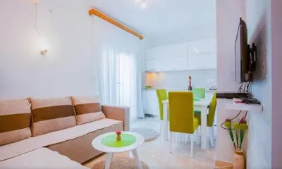 a living room with a couch and a table at Skadar Lake Apartment-Nikola in Podgorica