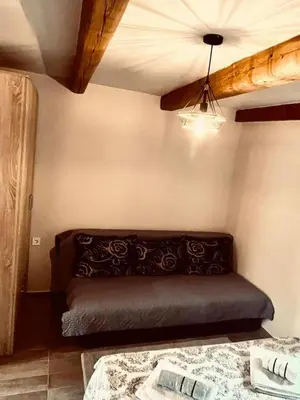 a room with a bed and a ceiling at Apartments Stella in Virpazar