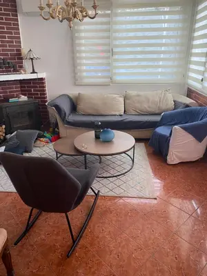 a living room with a couch and a table at Lavender Vacation Home, Bar in Bar
