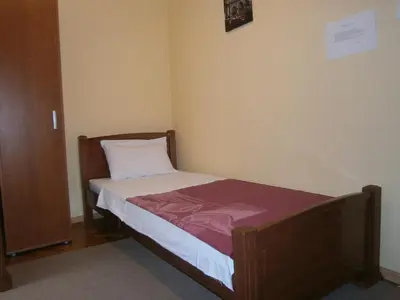 a small bed in a small room with at Vila Patria in Podgorica
