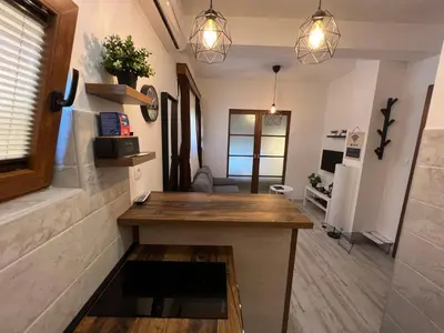 a kitchen with a island in a room at Apart 31 in Cetinje