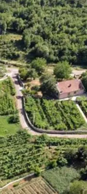 an aerial view of a house and a road at T&A Apartment in Rijeka Crnojevića