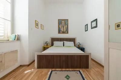 a bedroom with a bed in a room at CENTRAL CATHEDRAL APARTMENT in Kotor