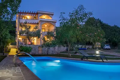 a house with a swimming pool in front of a house at Villa Marco Polo in Budva