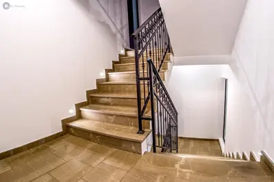 a set of stairs with metal railing in a building at Villa Marco Polo in Budva
