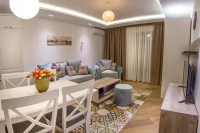 a living room with a couch and a table at Villa Marco Polo in Budva