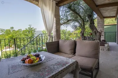 a bowl of fruit on a table on a porch at Villa Marco Polo in Budva