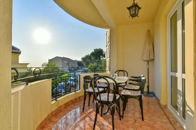 a balcony with a table and chairs on a balcony at Apartment Ruzica in Sveti Stefan
