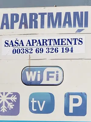 a sign for a carmarthen and other signs on a truck at Saša Apartments in Sutomore