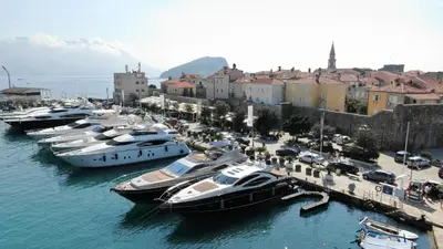 a bunch of boats are docked in a harbor at Apartments Aleksić Old Town in Budva