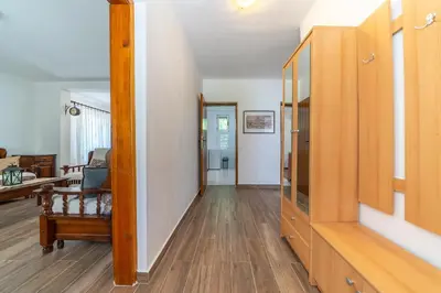 a hallway of a home with wooden floors at House Gorica in Bar
