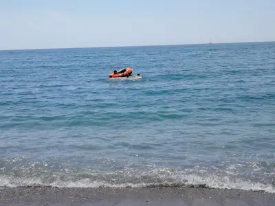a person is on a boat in the ocean at Vi apartment 1lin of the sea in Bar