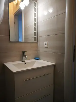 a bathroom with a sink and a mirror at Vi apartment 1lin of the sea in Bar