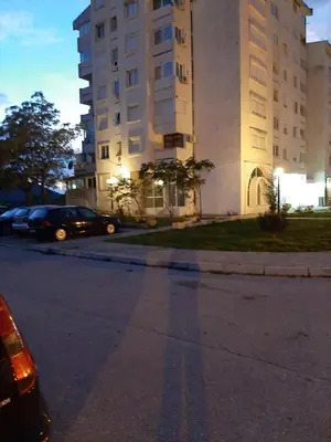 a building with cars parked in front of a street at 