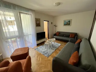 a living room with a couch and a tv at 