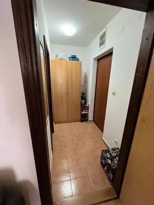 a hallway with a door leading into a room at 