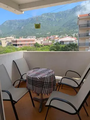 a table and chairs on a balcony with a view at 