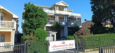 a house with a sign in front of it at Apartment's Meti in Ulcinj