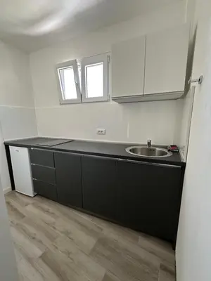 a kitchen with a sink and a counter top at Apartment's Meti in Ulcinj