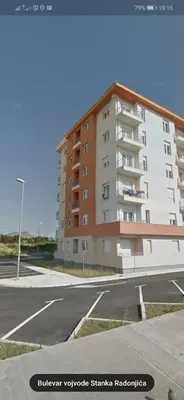 an empty parking lot in front of a building at Enigma in Podgorica