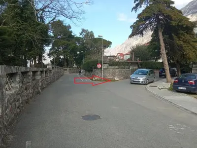 a stop sign in the middle of a street at Minka 2 in Kotor