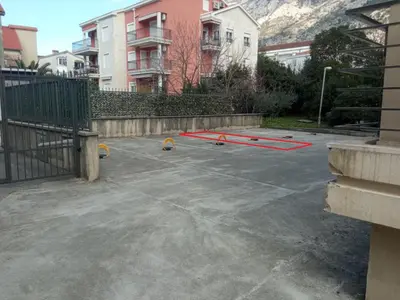a parking lot with a red line in a parking lot at Minka 2 in Kotor
