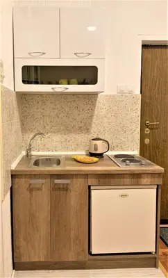 a kitchen with a sink and a counter top at Cicki Apartments II in Podgorica
