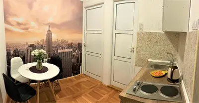 a small kitchen with a view of a city at Cicki Apartments II in Podgorica