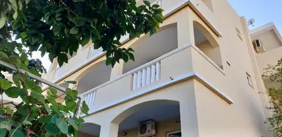 a building with a staircase on the side of it at Villa Rihter in Budva