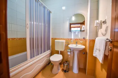 a bathroom with a toilet and a sink at Apartments Laguna in Ulcinj